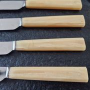 Philos - Set of 12 stainless steel dessert knives with bakelite handles.