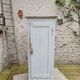 Old patinated bonnet maker