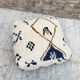 Berber floor pouf: Handwoven Moroccan wool cushion.
