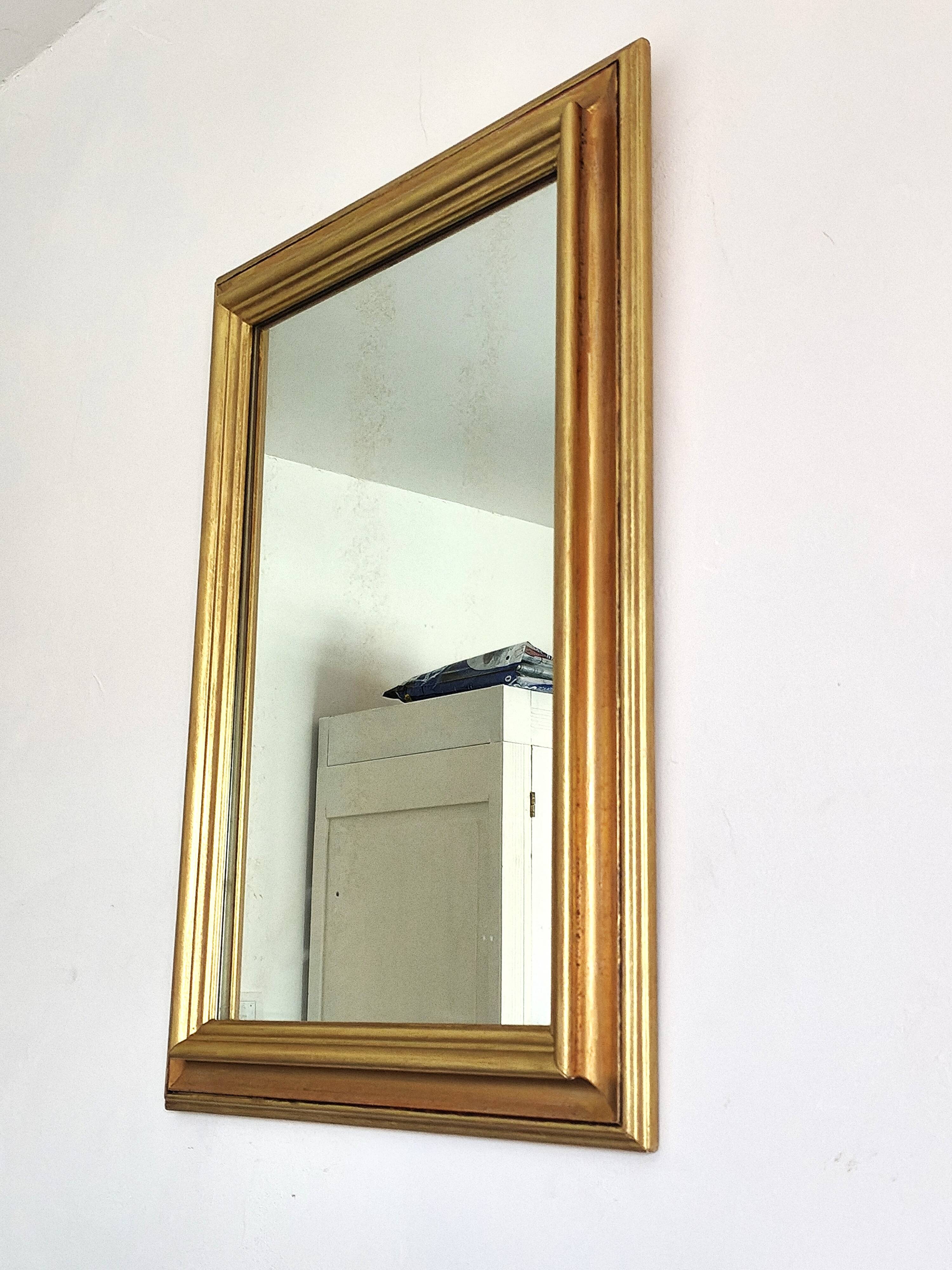 Miroir ancien en bois doré et cuivré