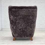 Années 1960, design danois, fauteuil rembourré, véritable peau de mouton.