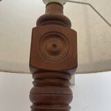 Brutalist floor lamp in turned wood, in the style of Charles Dudouyt.