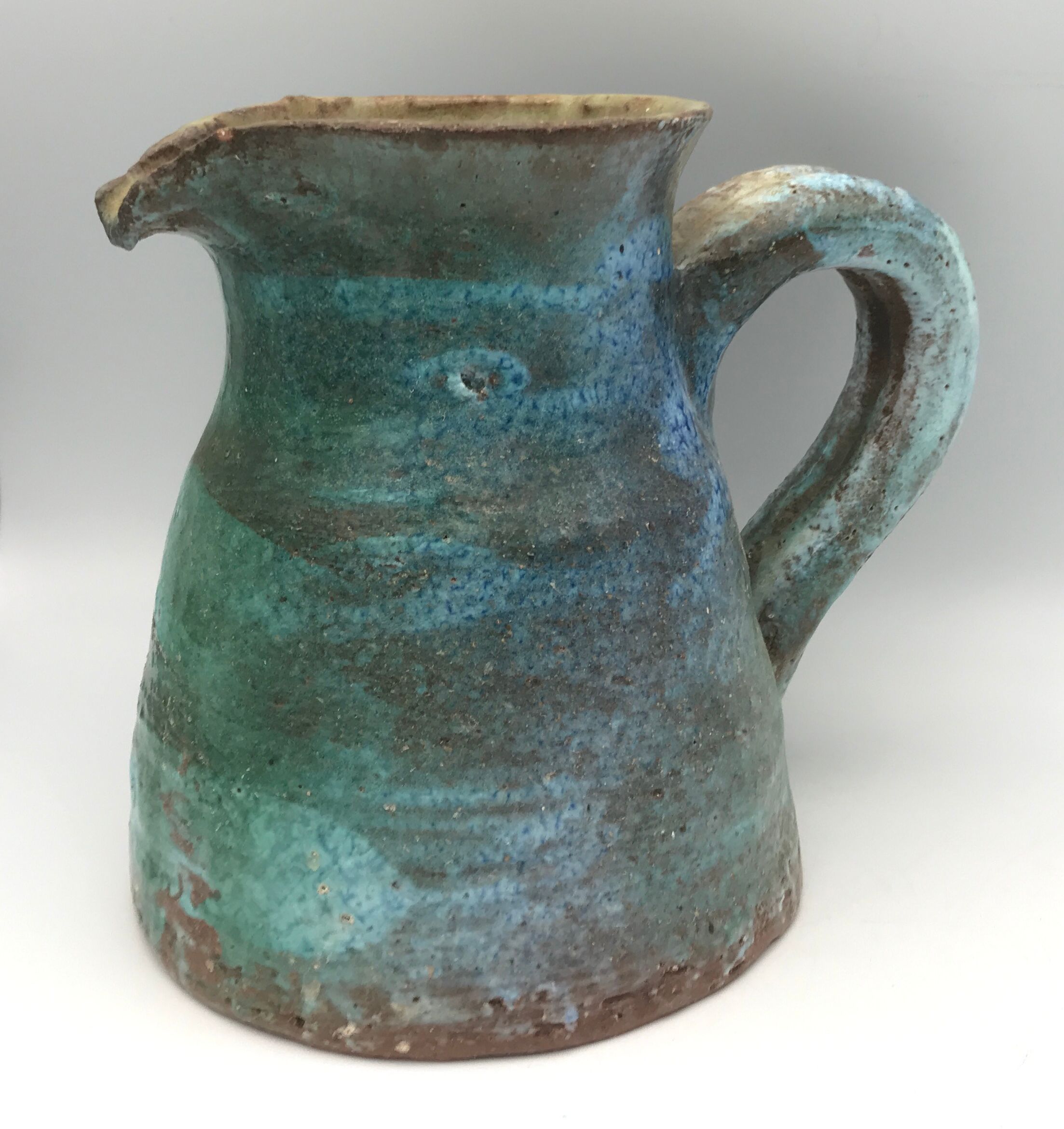 Vintage broc pitcher in enamelled sandstone with effect of blue shades, turquoise green signed