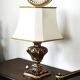 Florentine lamp in carved wood, gold leaf, silk shade.