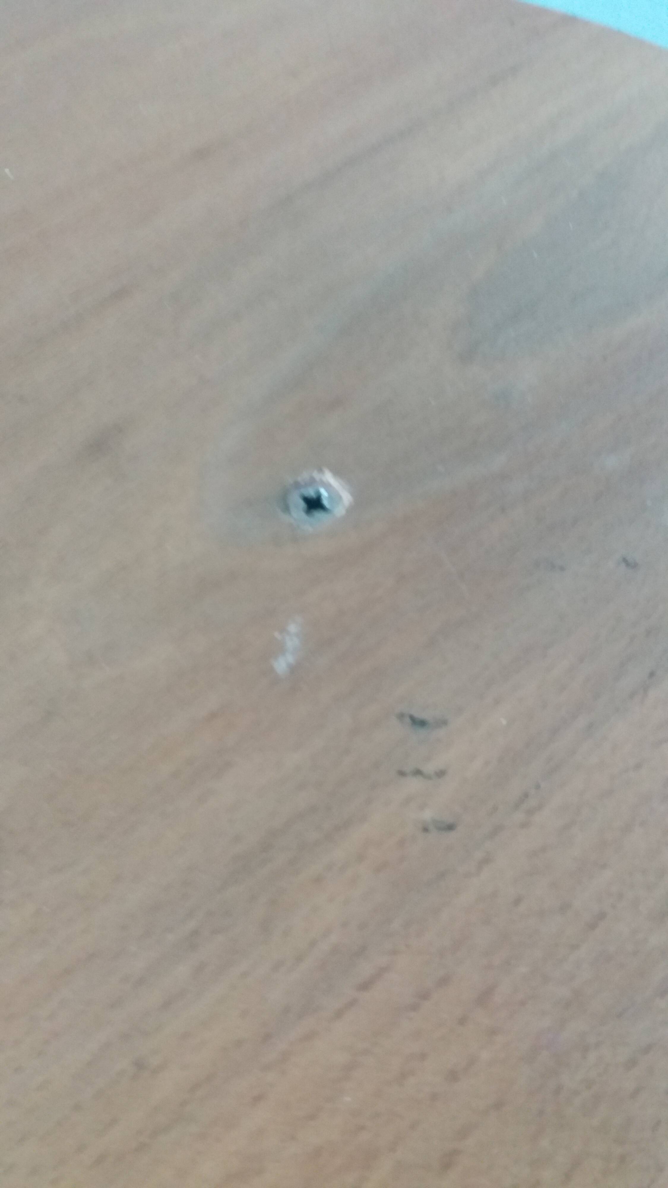 Tripod stool with a screw.