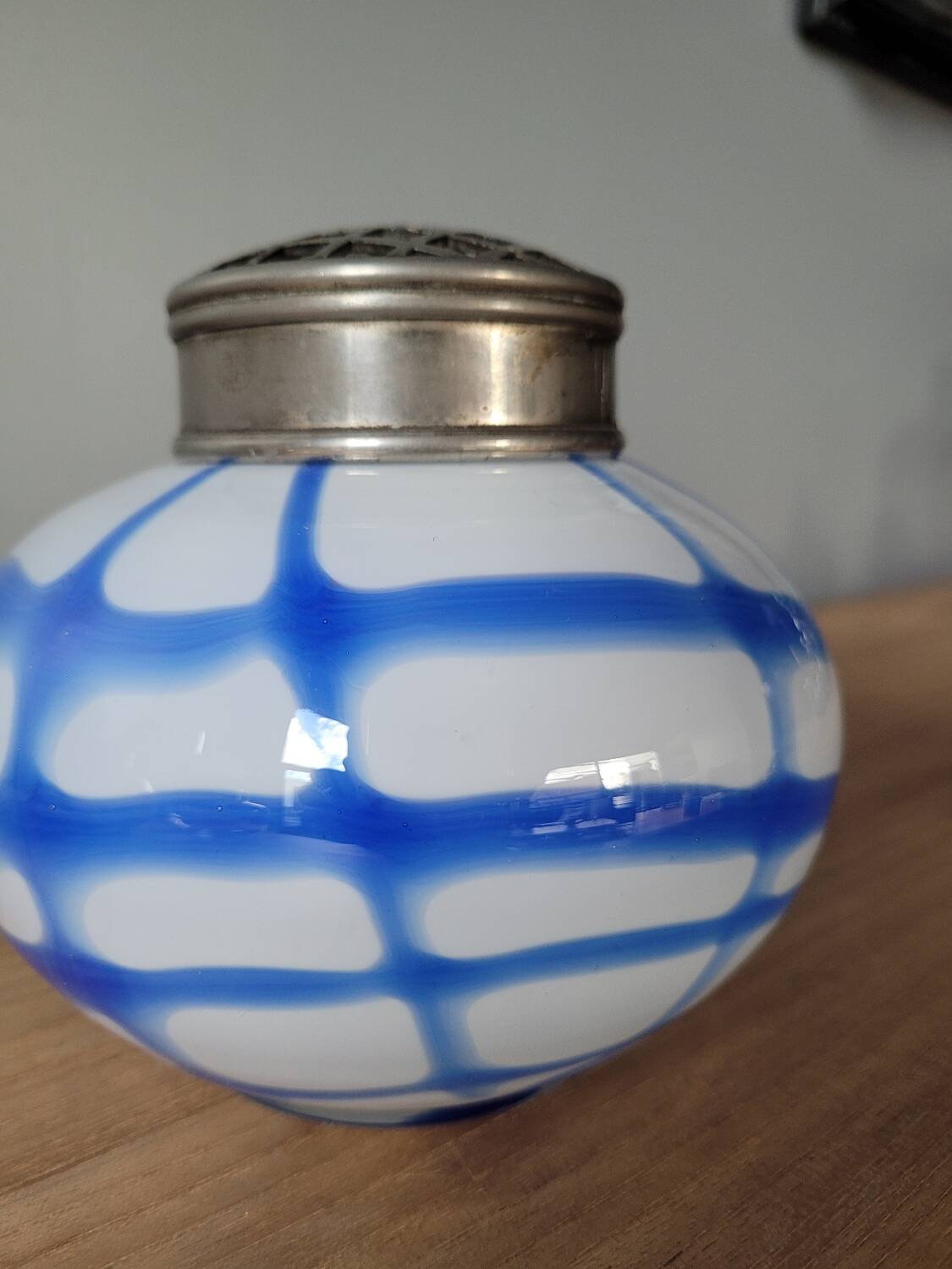 Old white and blue glass flower vase