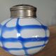 Old white and blue glass flower vase