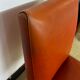 Pair of chairs in orange skaï