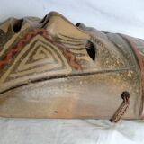 Terracotta mask with geometric decorations