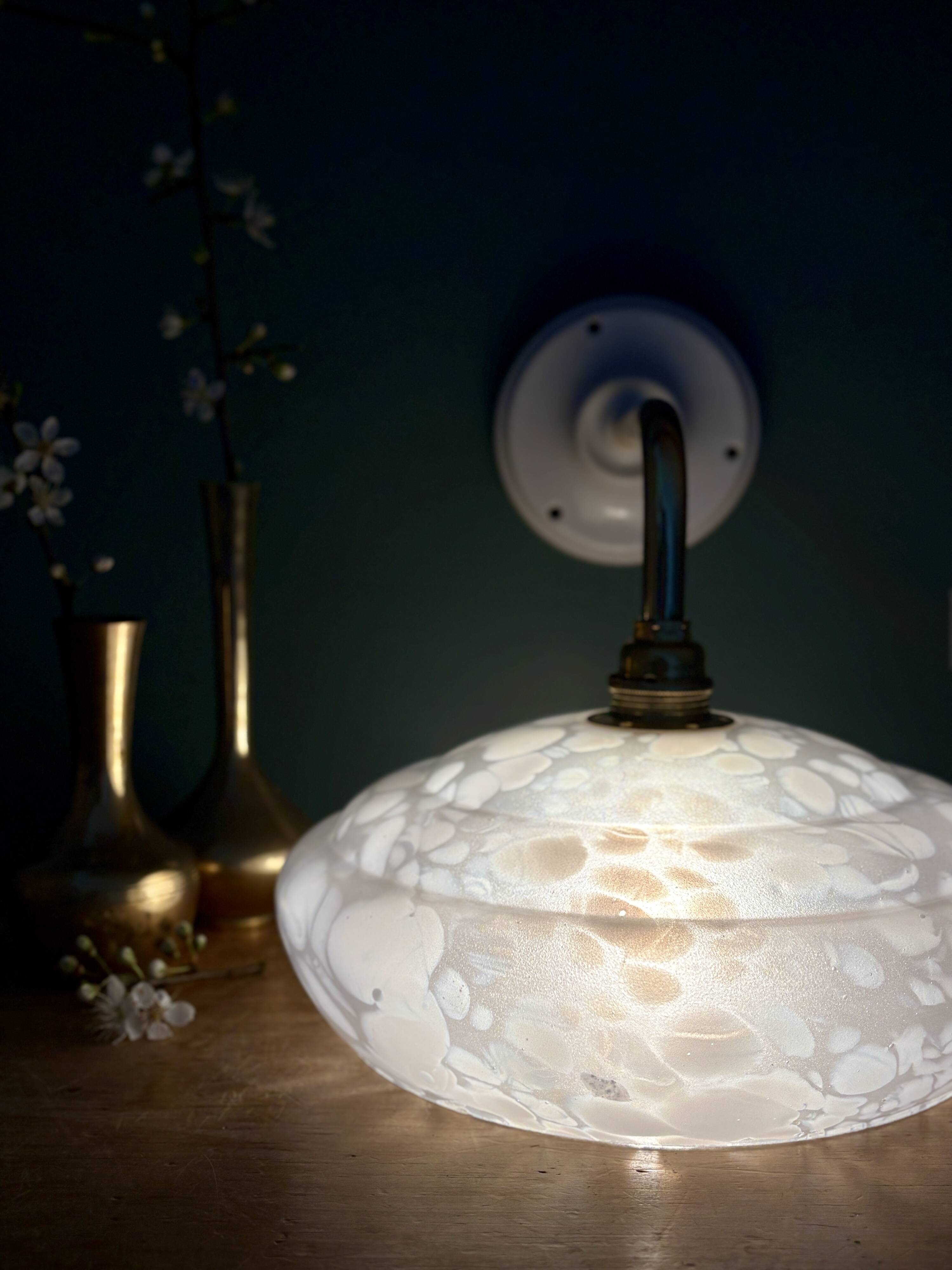 Vintage glass wall lamp with a white Clichy shade.