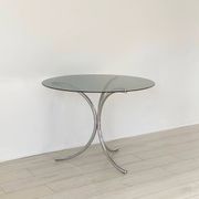Table for 4 people in smoked glass and metal, 1970.