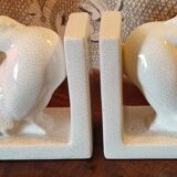 Pair of greenhouse art-deco books about cracked earthenware bird