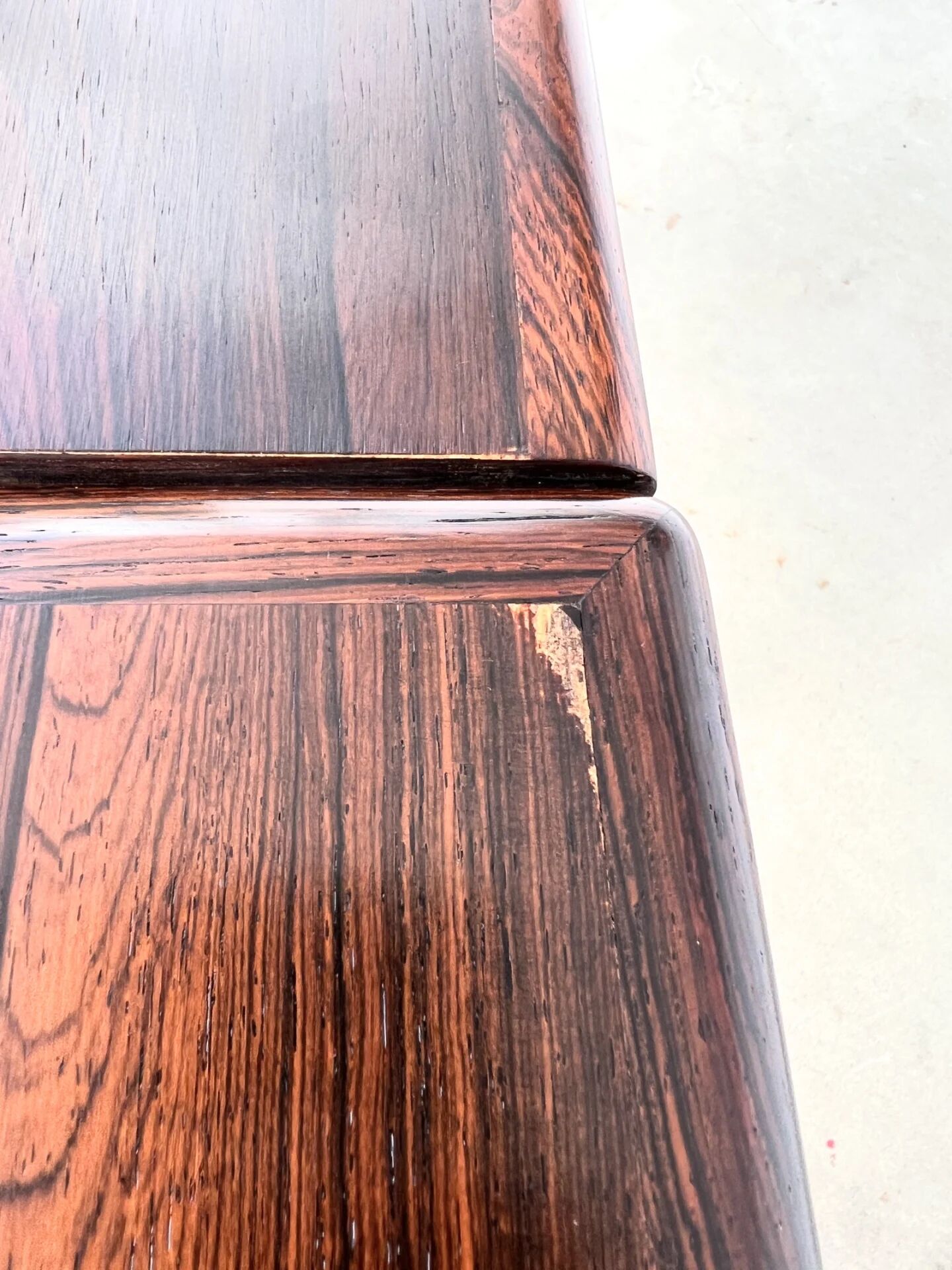 Rosewood dining table with integrated extensions — Denmark, 1960s