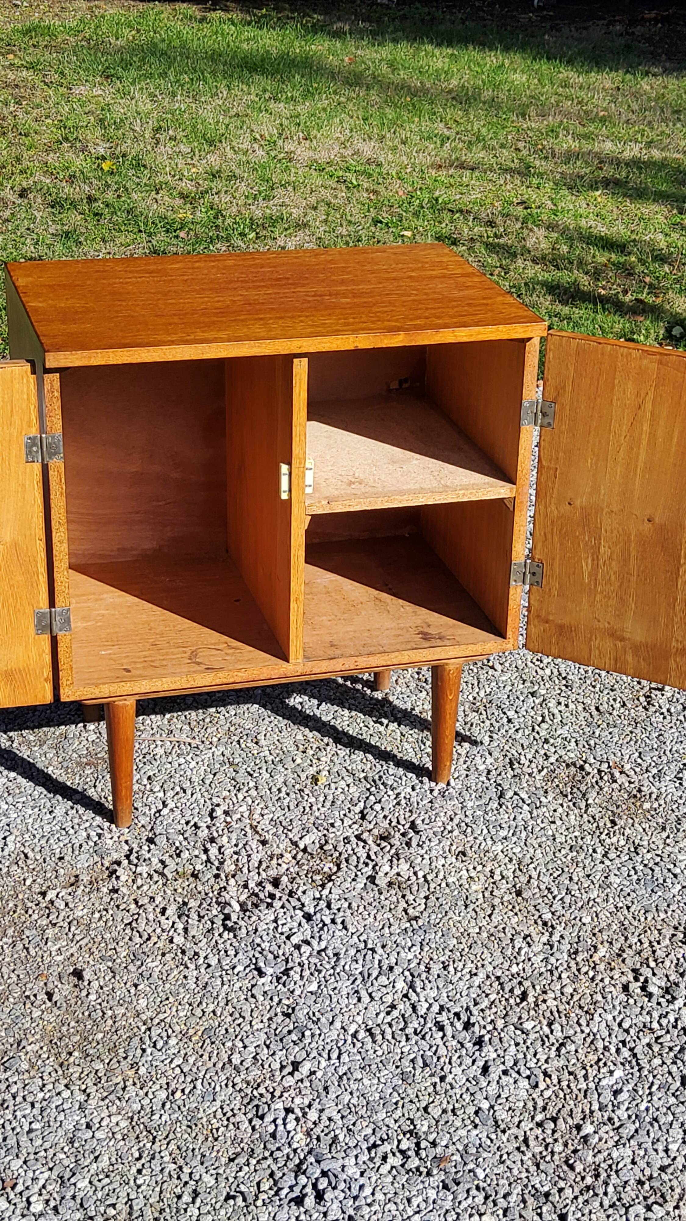 Vintage golden oak sideboard with conical legs from the 1950s