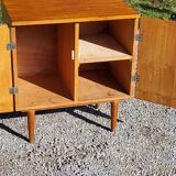 Vintage golden oak sideboard with conical legs from the 1950s