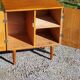 Vintage golden oak sideboard with conical legs from the 1950s