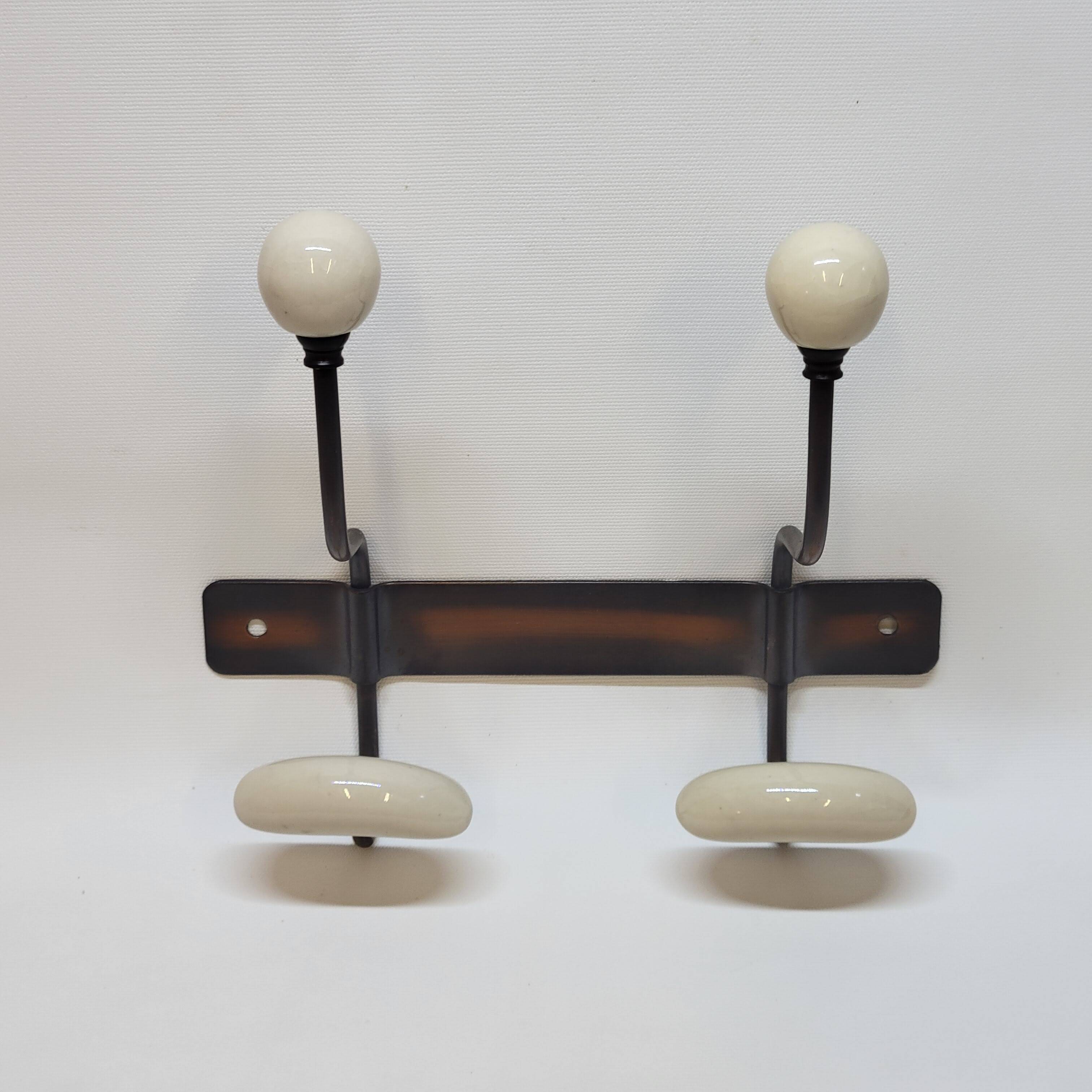 Wall coat rack in metal and porcelain with 2 hooks