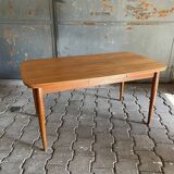 Extendable teak dining table