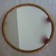 Old gilded wood oval mirror