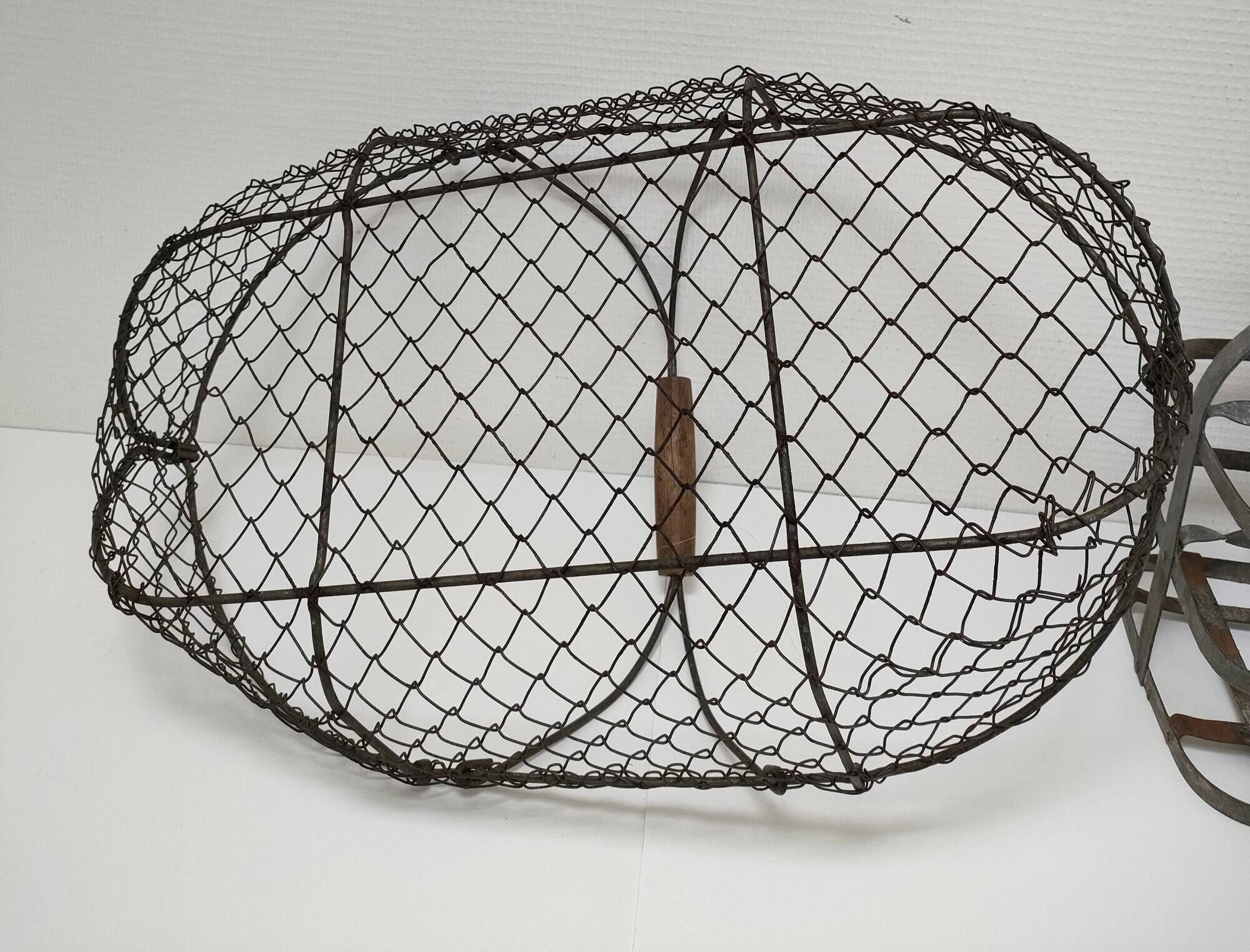 Two baskets metal and patinated wood early twentieth century