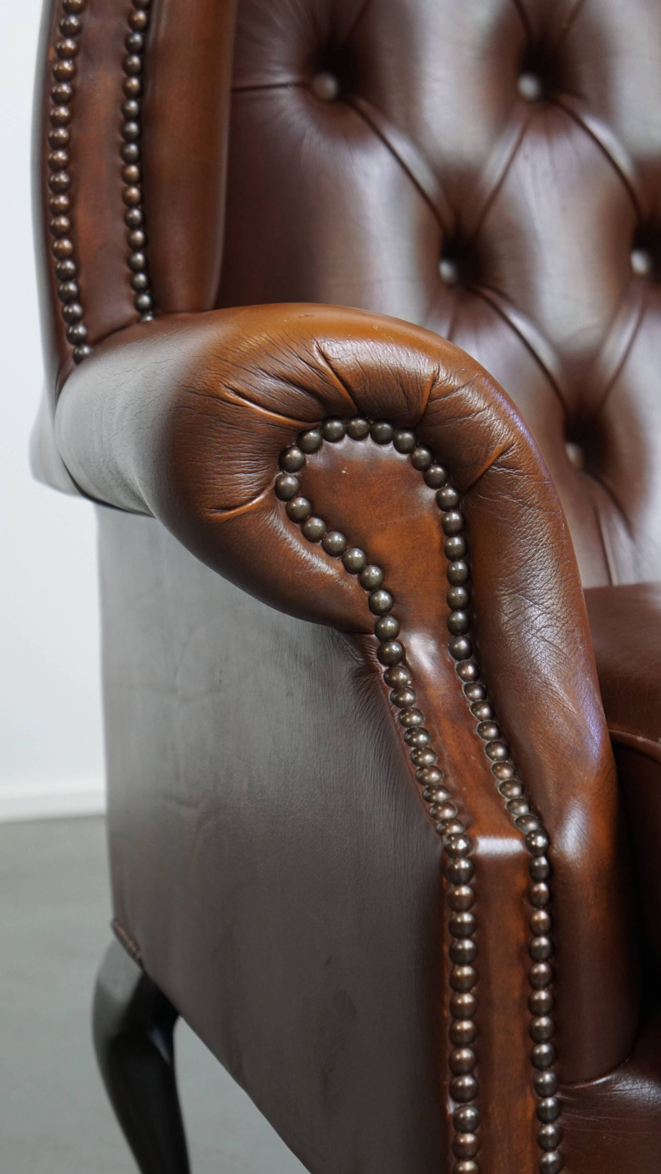 Chesterfield wing chair in dark brown English cowhide