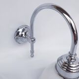 Swan neck and white glass wall lights