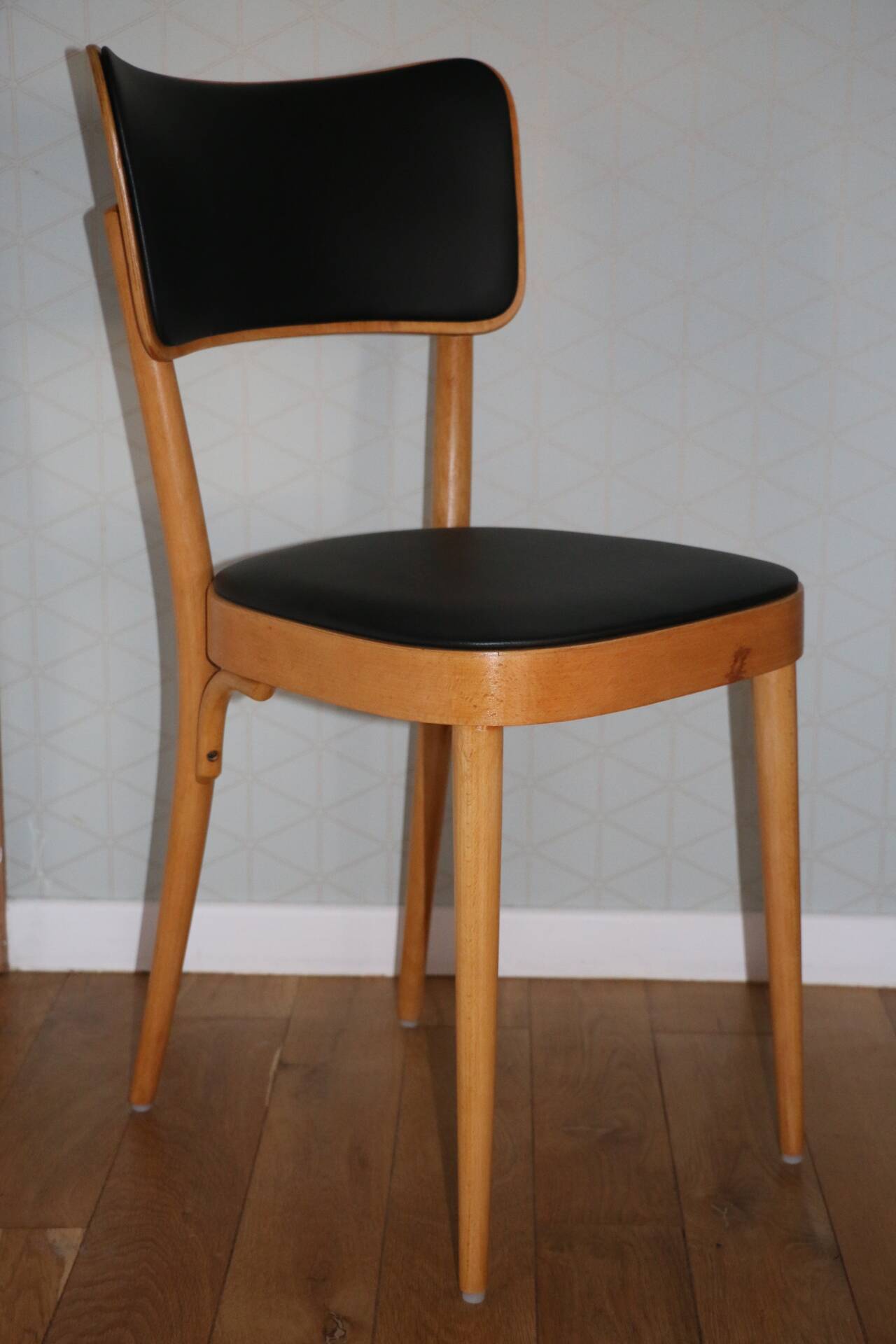 5 baumann chairs with large backs in black faux leather.