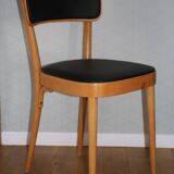 5 baumann chairs with large backs in black faux leather.