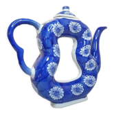 Old Asian teapot in toroidal shape in blue porcelain with floral decoration 20th century