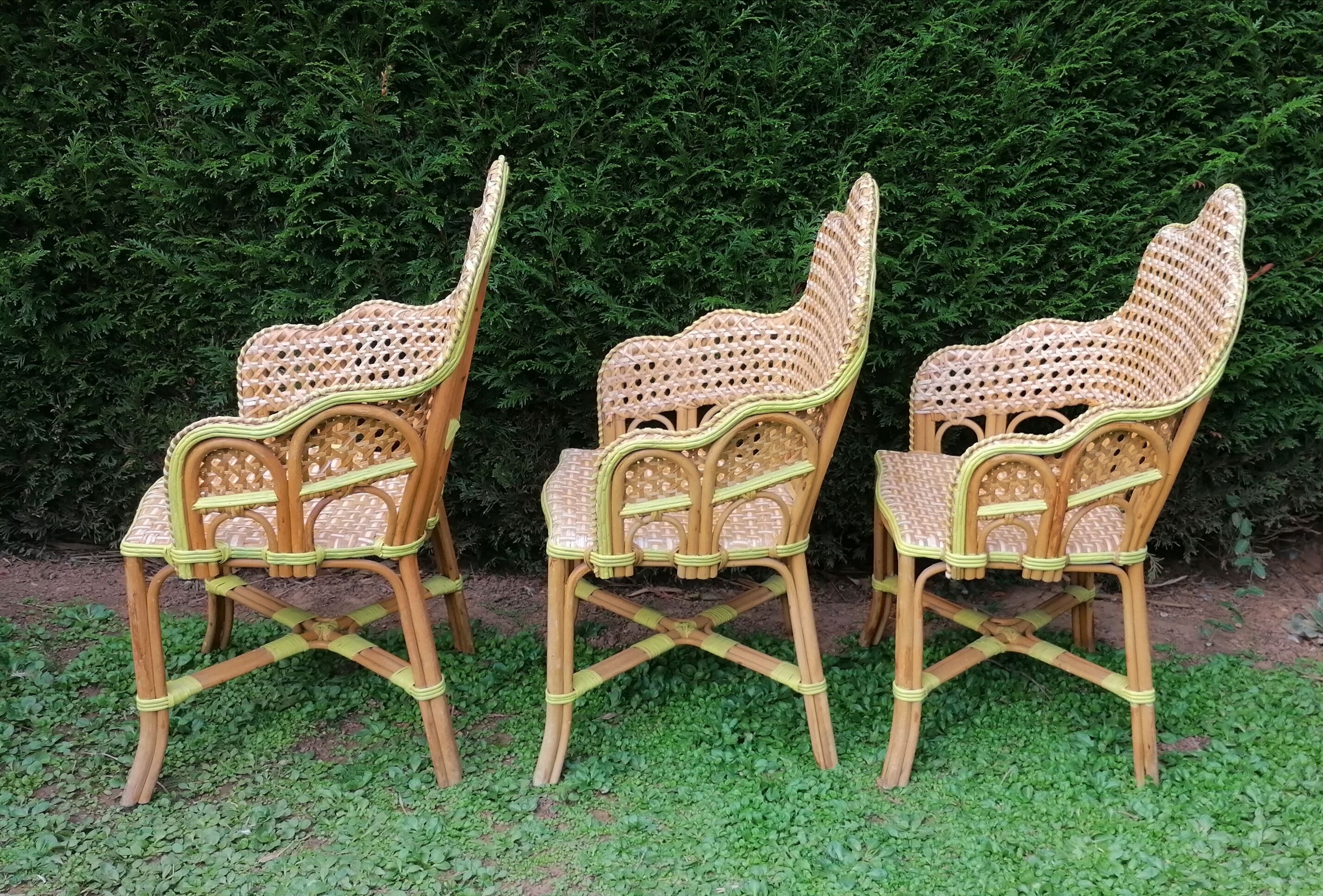3 woven rattan armchairs