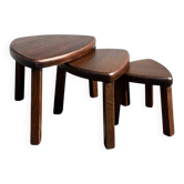 Nested tripod tables made of solid wood, in a modernist brutalist style.