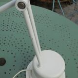 Massive swing desk lamp has two lights and a kneecap