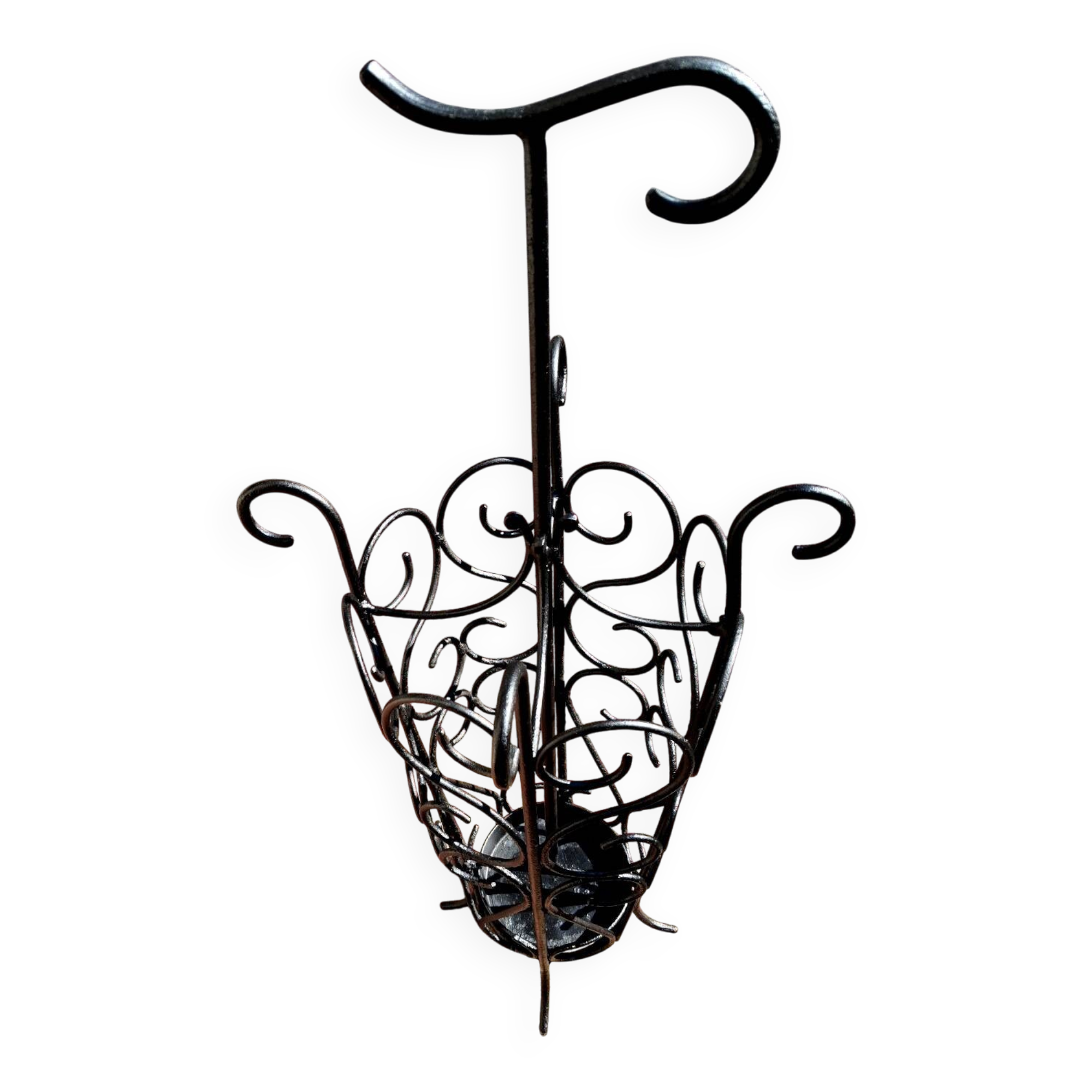 Antique wrought iron umbrella stand for entrance hall, vintage decor.