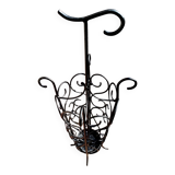 Antique wrought iron umbrella stand for entrance hall, vintage decor.