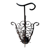 Antique wrought iron umbrella stand for entrance hall, vintage decor.