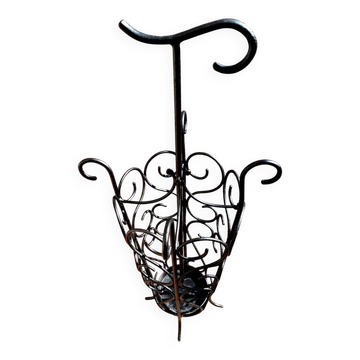 Antique wrought iron umbrella stand for entrance hall, vintage decor.