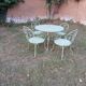 Garden furniture set with 1 table, 2 armchairs, and 2 chairs in antique green wrought iron.
