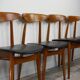 Set of 4 chairs 60s in teak and black leatherette