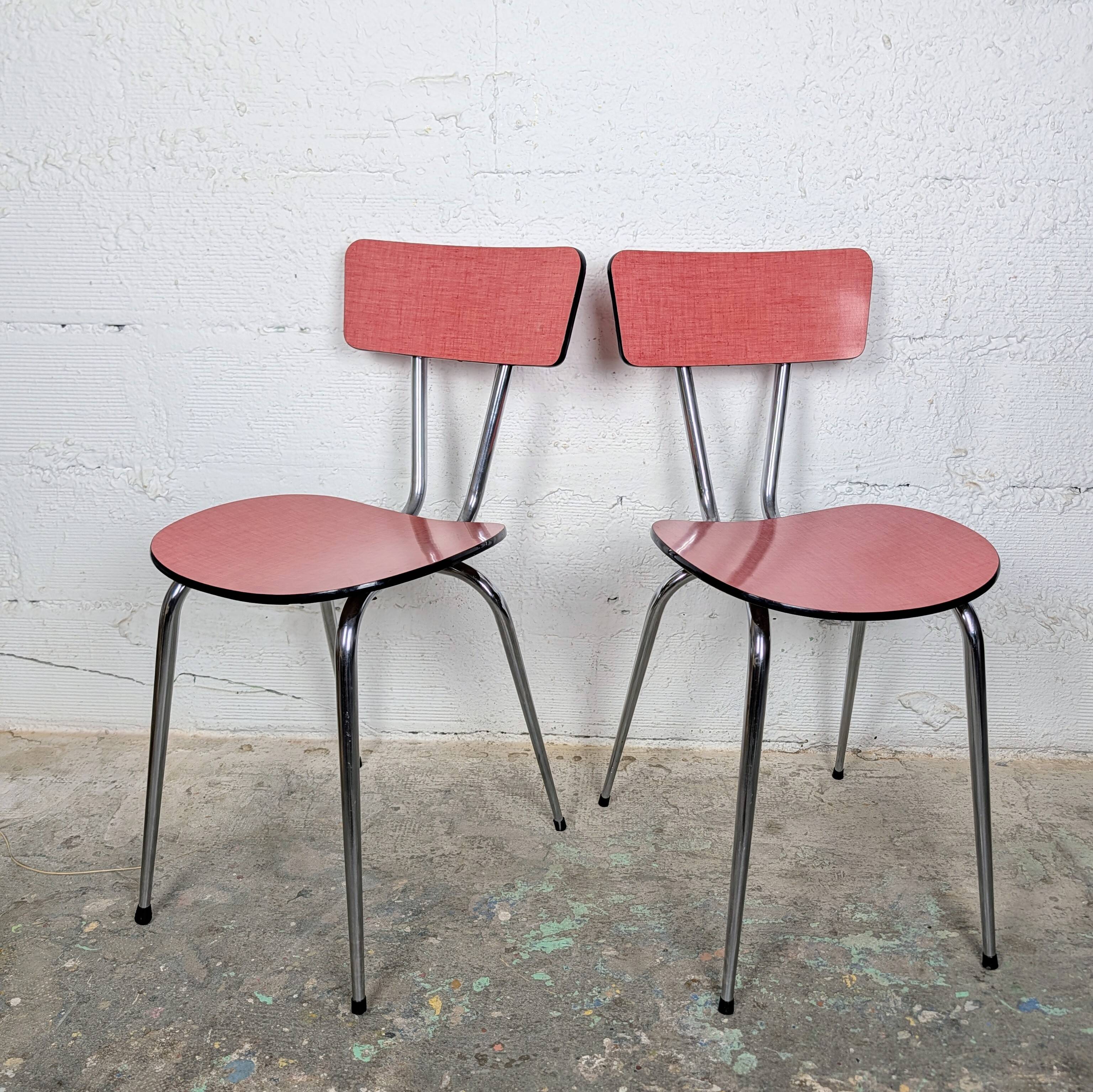 Pair of red Formica chairs with chrome legs
