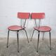 Pair of red Formica chairs with chrome legs