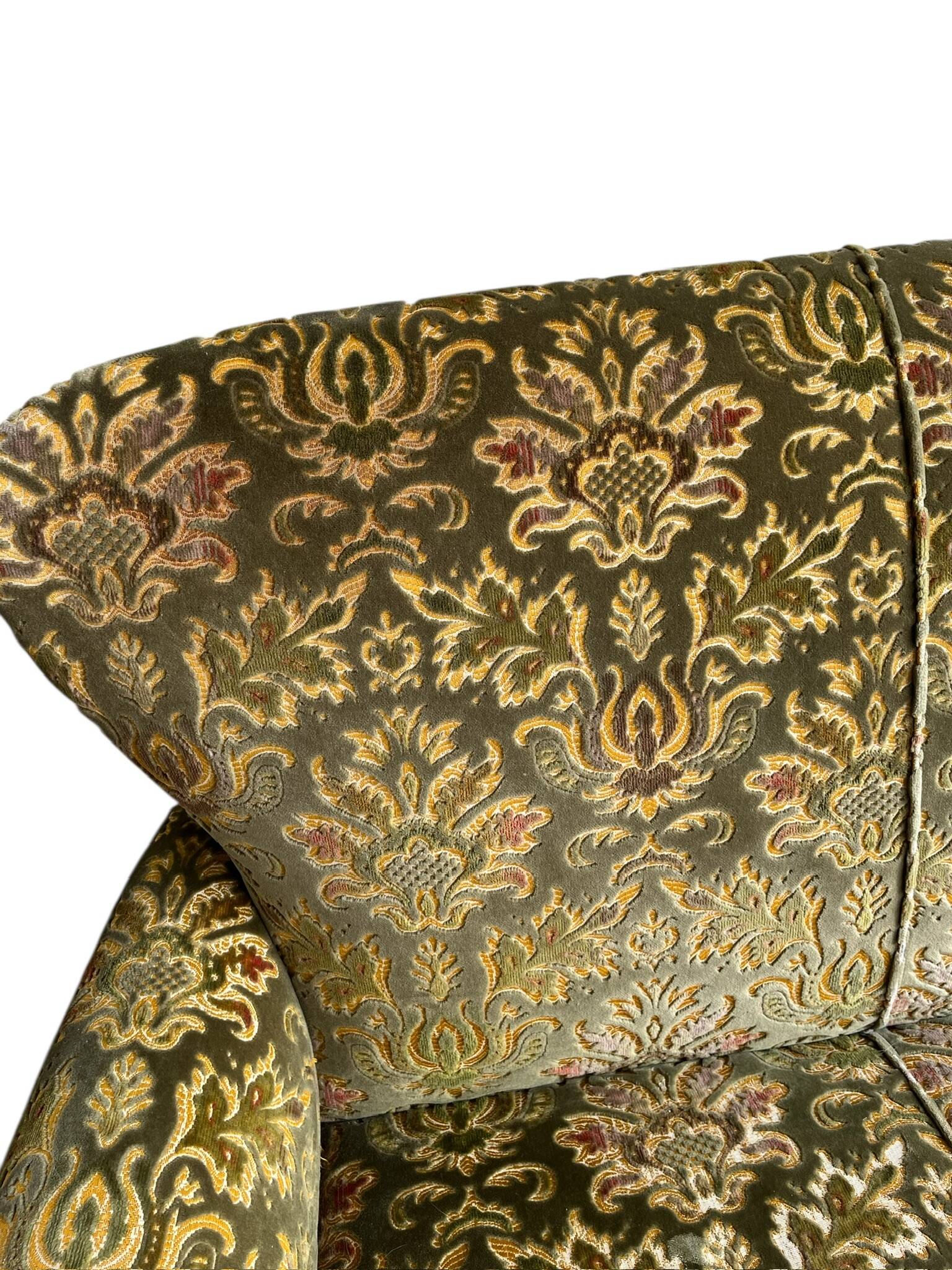 Vintage baroque chair with a rich floral pattern