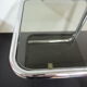 Side table in chrome and glass