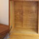 Vintage 1960s secretary in oak veneer with a drop-down front.