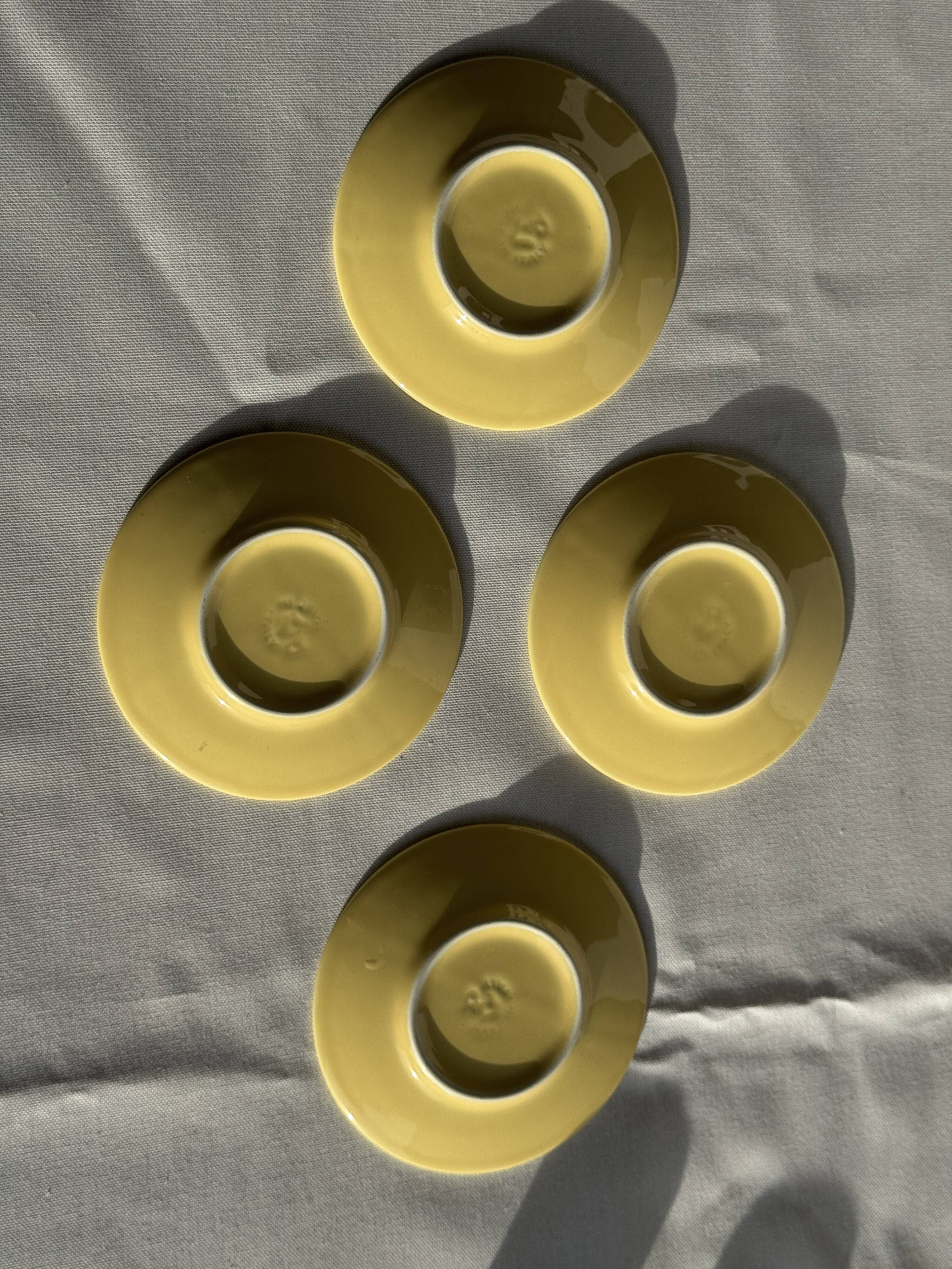 Set of 4 vintage yellow Italian espresso cups and saucers.