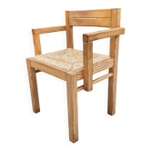 Fauteuil brutaliste en pin massif et assise paillée des années 70