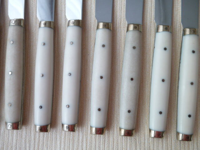 Set of 12 vintage stainless steel bakelite and brass table knives
