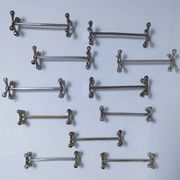 Eleven 70s design metal "crosshair" knife holders