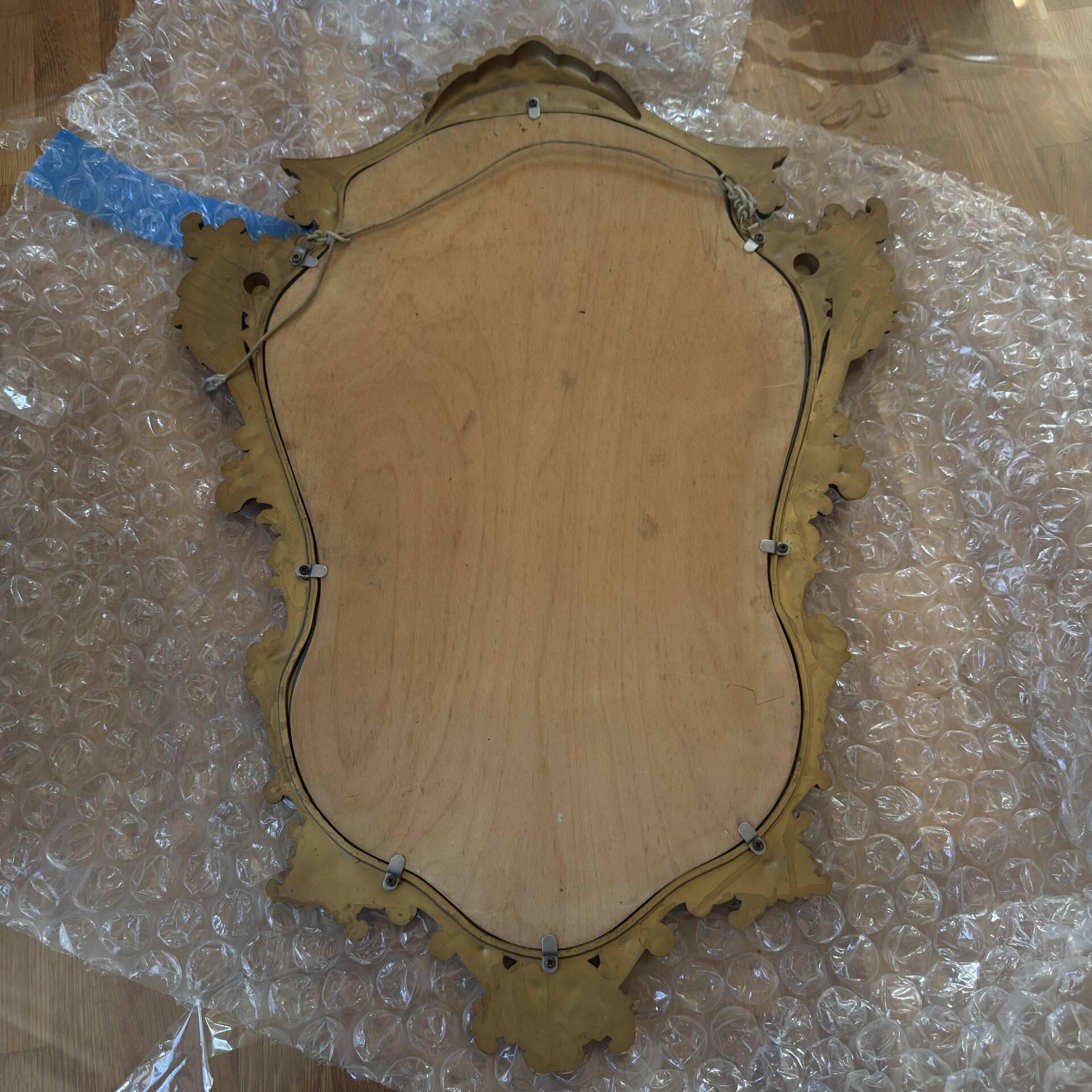 Antique mirror in Louis XV Rocaille style with carved frame.