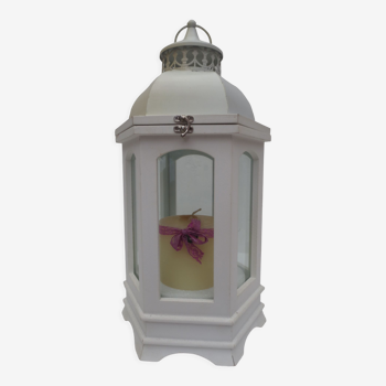 White lantern with candle, wood and windows, hexagonal shape