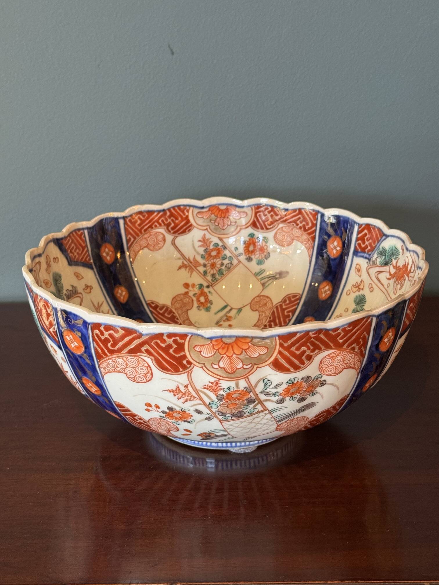 Hand-painted Imari porcelain bowl with an elegant scalloped rim